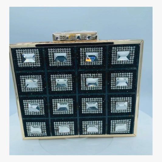 Front view of the Diamond Clutch showing black panels, clear embellishments, and gold-tone frame