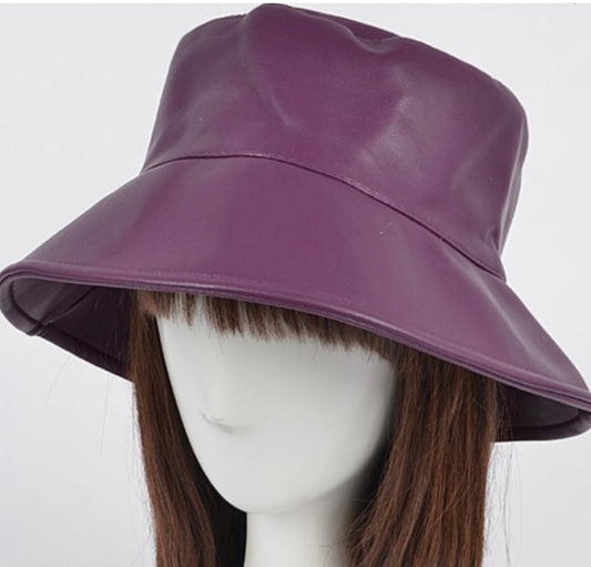Purple faux leather bucket hat on mannequin