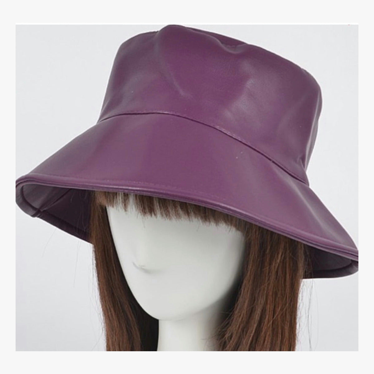 Purple faux leather bucket hat on mannequin