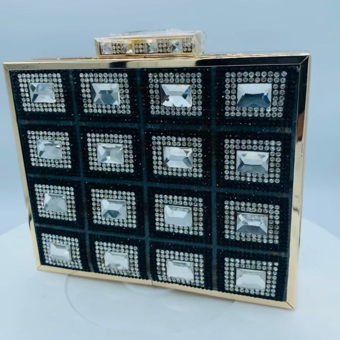 Angled view of the jewel-embellished Diamond Clutch