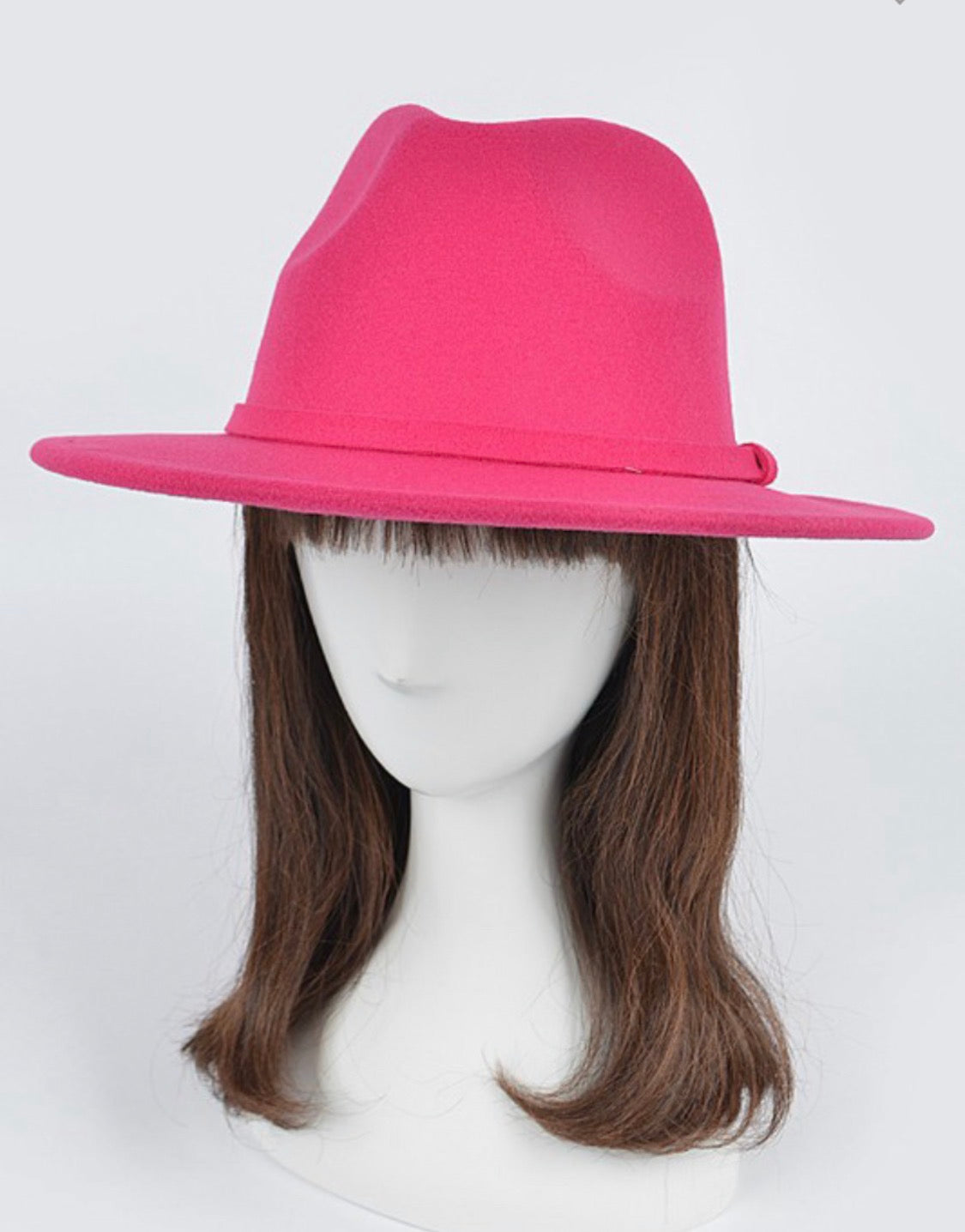 Hot pink fedora on mannequin